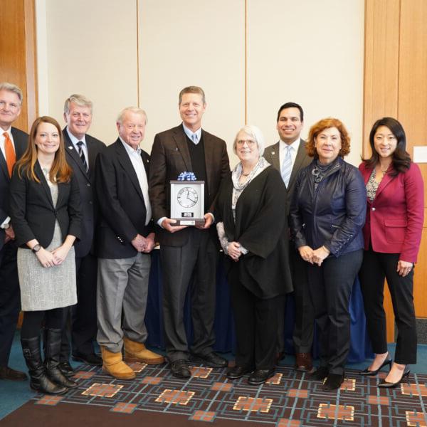 David Hooker, pictured with members of the GVSU Board of Trustees, President Thomas J. Haas and Robert Hooker.